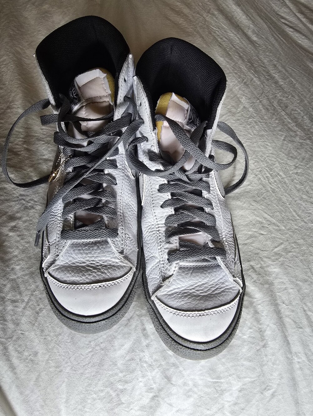 White Nike and Gray High-Top Sneakers